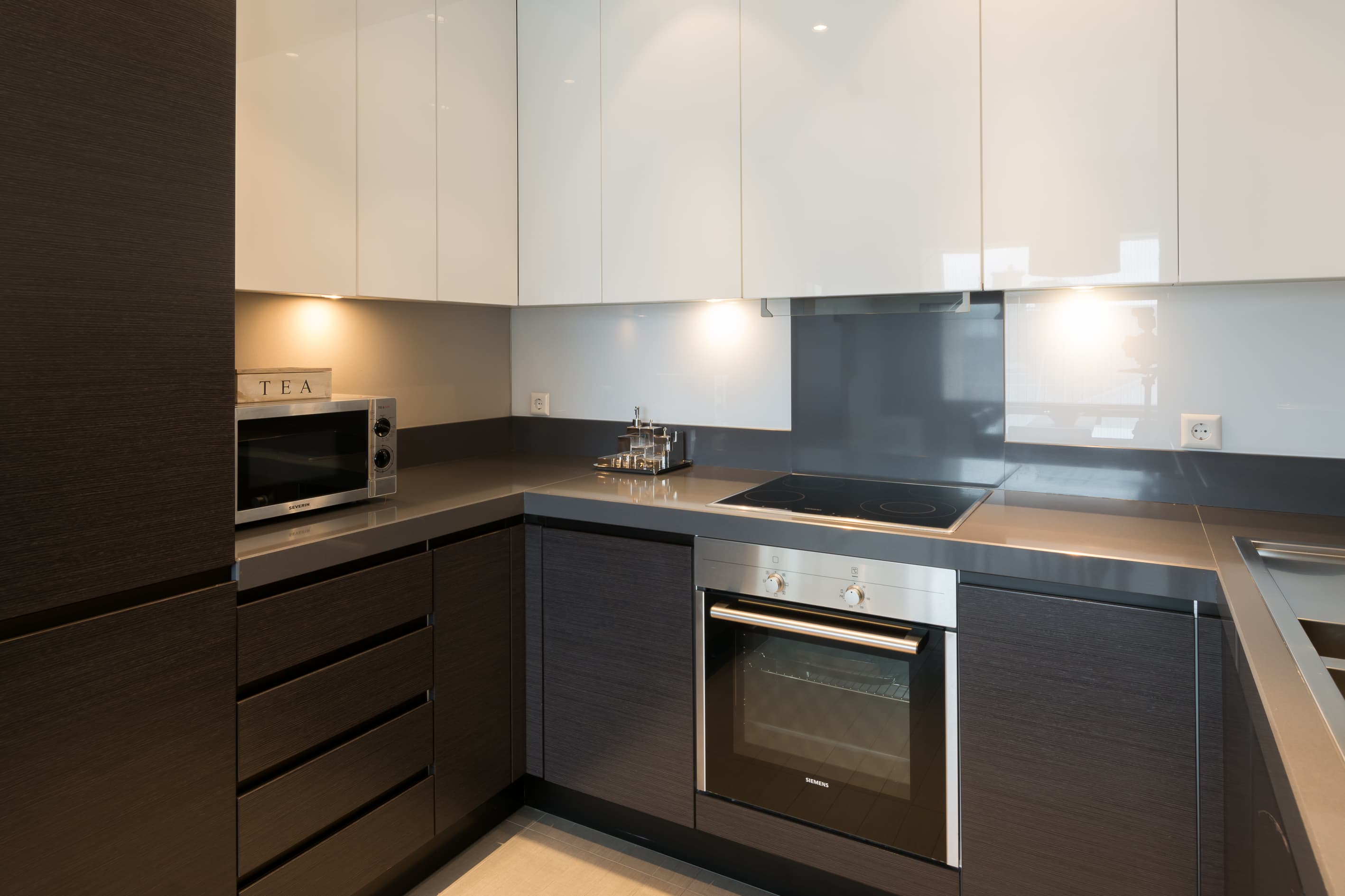 A modern kitchen at Four Stars Apart Hotel.