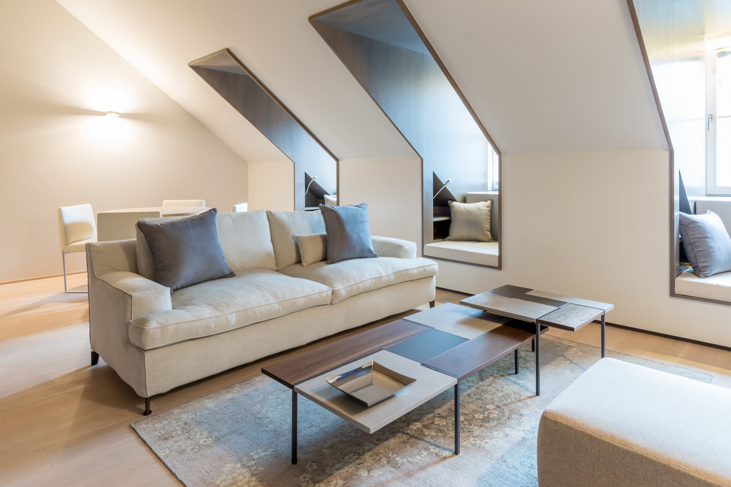 Attic living room with sloped ceilings at Relais Louvigny.